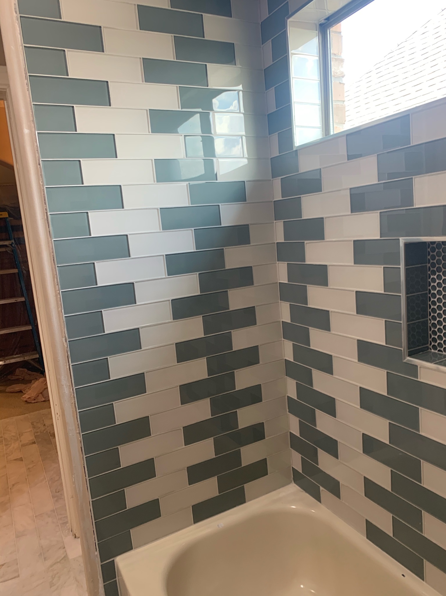 green and white shower installation, wfa's custom hardwood floors, houston texas